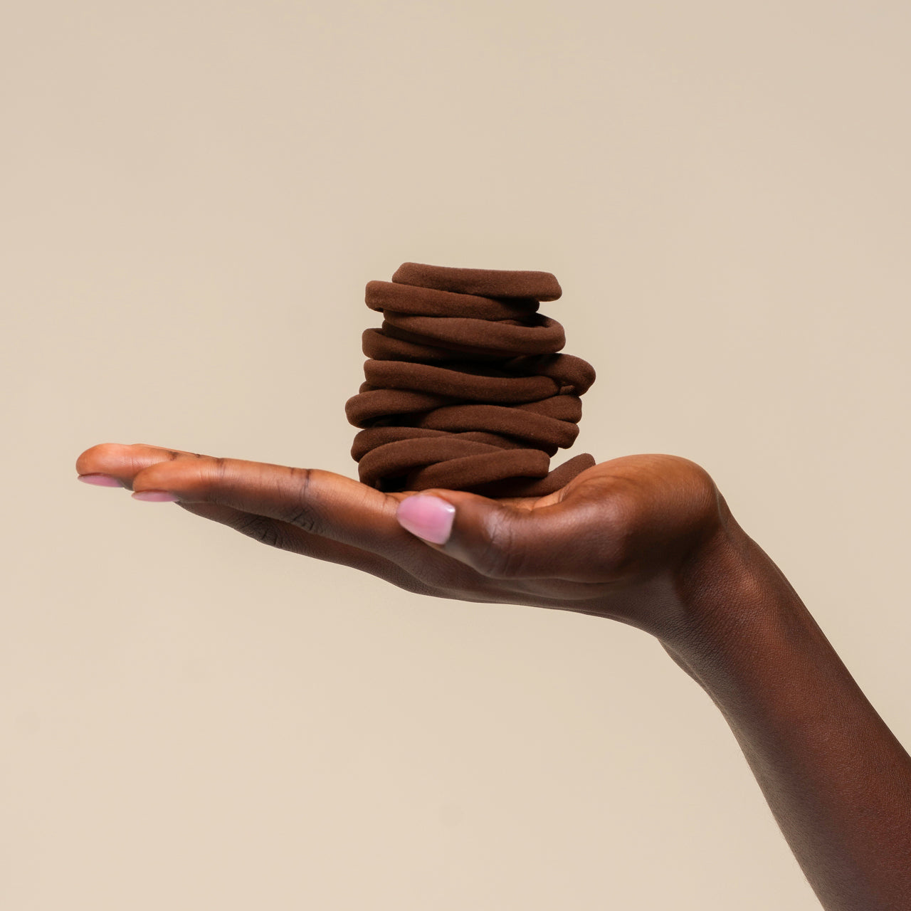 508740-RecycledFabricSeamlessHairElastics-20pc-TrendHairAccessories-Chocolate-Model-Hand-1280x1280px.jpg