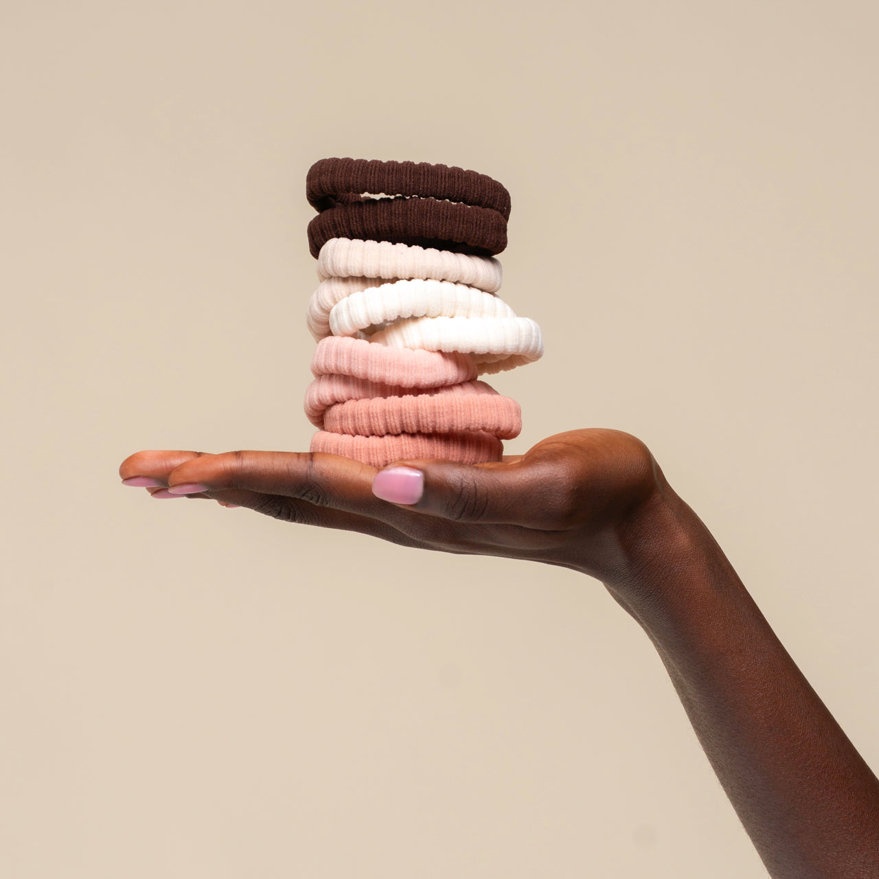 508764-RecycledFabricRibbedHairElastics-10pc-TrendHairAccessories-Blush-Model-Hand-1280x1280px_1.jpg