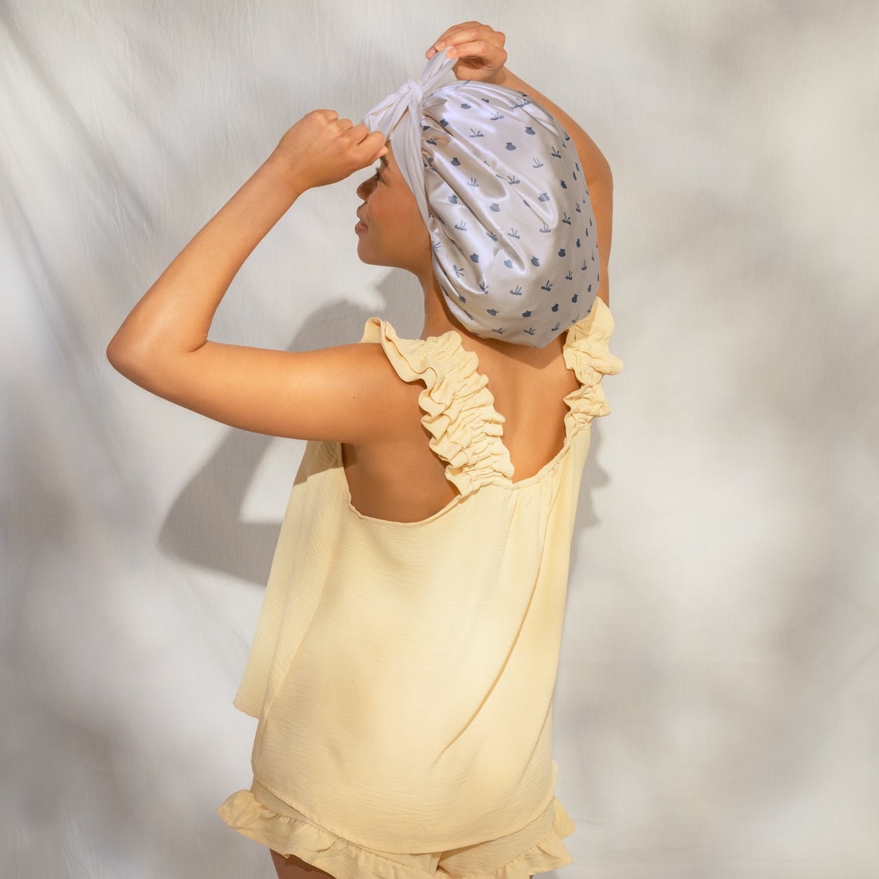 509518-CoastalCottage-OversizedSatinBonnet-PearlizedCream_CoastalBlue-Model-3-1280x1280px-1.jpg
